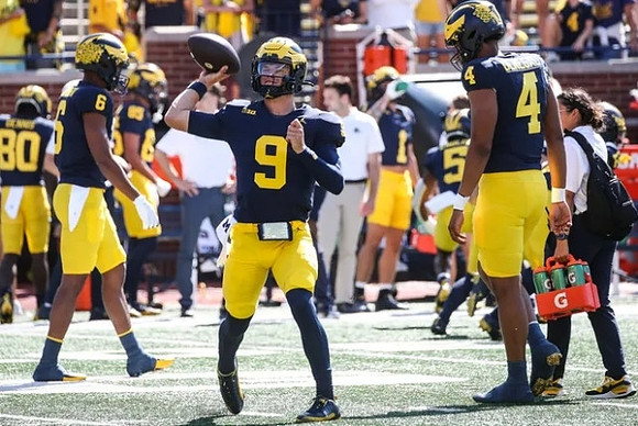Cornelius Johnson (6), J.J. McCarthy (9), and Jayden Denegal (4)