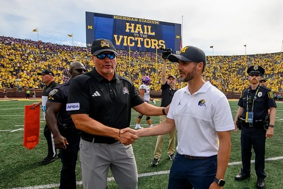 East Carolina Head Coach Mike Houston and Jesse Minter