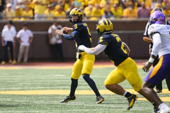 J.J. McCarthy (9) and Blake Corum (2)