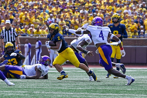 Trente Jones (53), Blake Corum (2), and J.J. McCarthy (9)