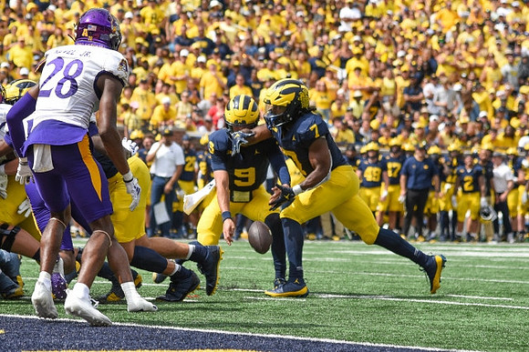 J.J. McCarthy (9) and Donovan Edwards (7)