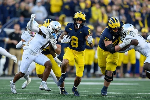 Tyler Morris (8) and Evan Link (71)