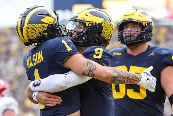 Roman Wilson (1), J.J. McCarthy (9), and Zak Zinter (65)