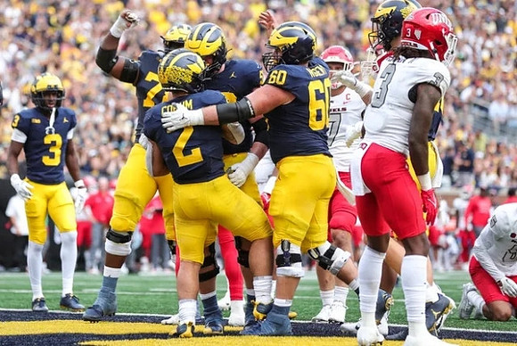 Blake Corum (2), Blake Corum (2), Myles Hinton (78), J.J. McCarthy (9), and Drake Nugent (60)