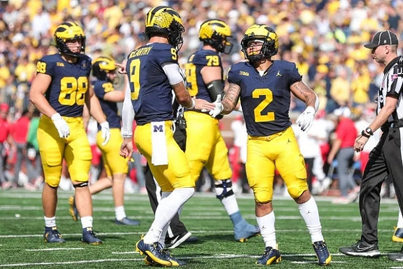 Matthew Hibner (88), J.J. McCarthy (9), Jeffrey Persi (79), and Blake Corum (2)