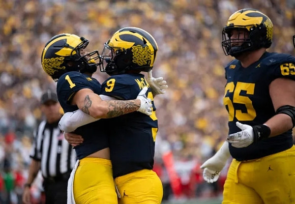 Roman Wilson (1), J.J. McCarthy (9), and Zak Zinter (65)
