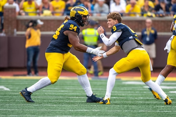 Kris Jenkins (94) and J.J. McCarthy (9)