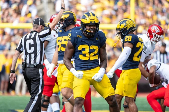 Mason Graham (55), Jaylen Harrell (32), and Quinten Johnson (28)