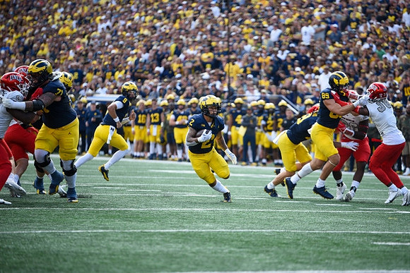 Myles Hinton (78), J.J. McCarthy (9), Blake Corum (2), and AJ Barner (89)
