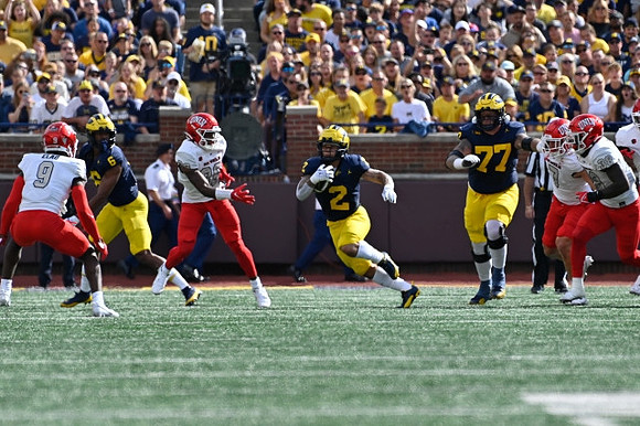 Cornelius Johnson (6), Blake Corum (2), and Trevor Keegan (77)