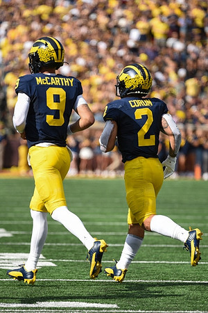 J.J. McCarthy (9) and Blake Corum (2)