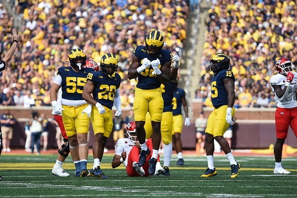 Mason Graham (55), Quinten Johnson (28), Jaylen Harrell (32), and Ernest Hausmann (15)