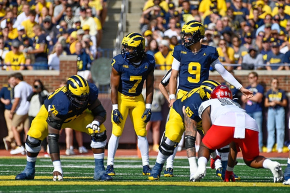 Myles Hinton (78), Donovan Edwards (7), J.J. McCarthy (9), and Zak Zinter (65)