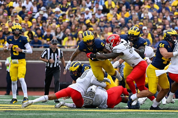J.J. McCarthy (9), Drake Nugent (60), Blake Corum (2), Myles Hinton (78), and Max Bredeson (44)