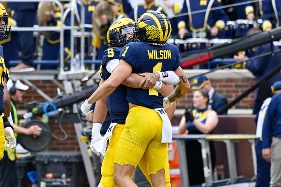 J.J. McCarthy (9) and Roman Wilson (1)
