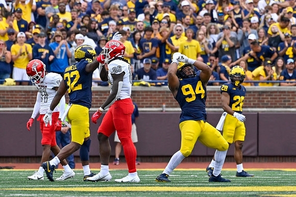 Jaylen Harrell (32), Kris Jenkins (94), and Quinten Johnson (28)