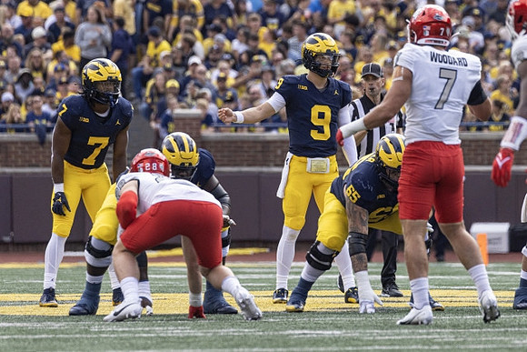 Donovan Edwards (7), J.J. McCarthy (9), and Zak Zinter (65)