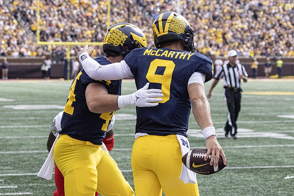 Max Bredeson (44) and J.J. McCarthy (9)