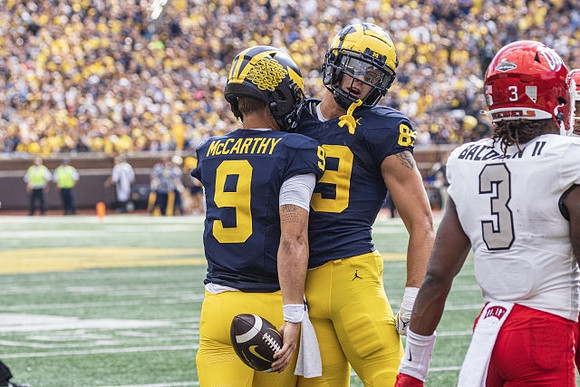 J.J. McCarthy (9) and AJ Barner (89)