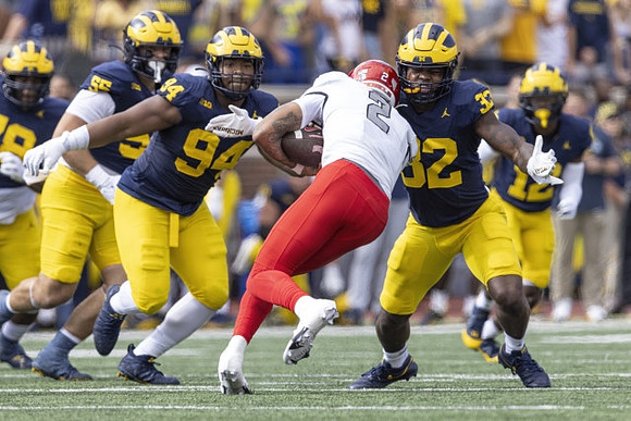 Mason Graham (55), Kris Jenkins (94), and Jaylen Harrell (32)