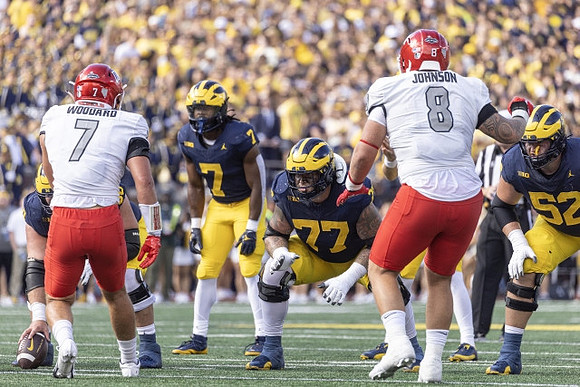 Donovan Edwards (7), Trevor Keegan (77), and Karsen Barnhart (52)