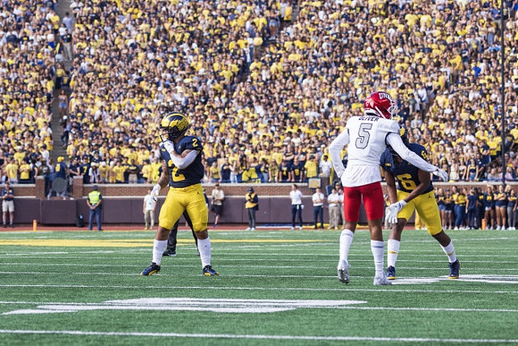 Blake Corum (2) and Cornelius Johnson (6)