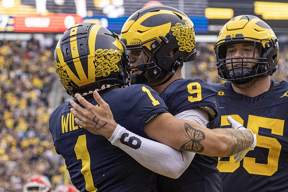 Roman Wilson (1), J.J. McCarthy (9), and Zak Zinter (65)