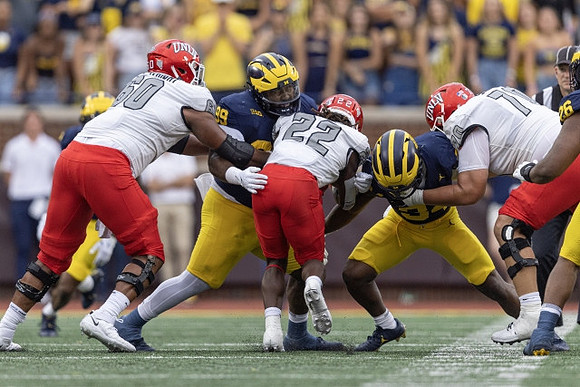 Cam Goode (99), Jaydon Hood (34), and Rayshaun Benny (26)