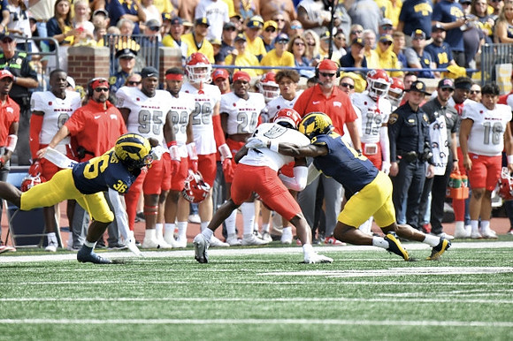 Keshaun Harris (36) and Mike Sainristil (0)