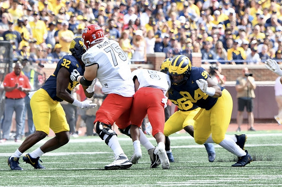 Jaylen Harrell (32), Keshaun Harris (36), and Kris Jenkins (94)