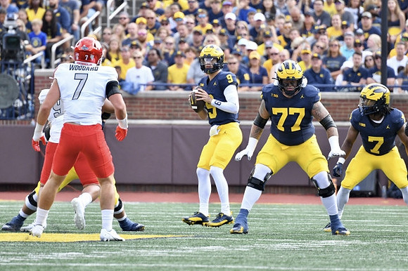 J.J. McCarthy (9), Trevor Keegan (77), and Donovan Edwards (7)