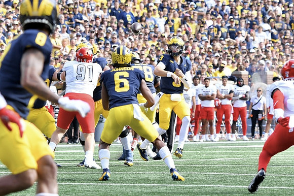 Tyler Morris (8), Cornelius Johnson (6), Myles Hinton (78), and J.J. McCarthy (9)
