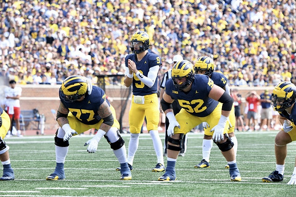 Trevor Keegan (77), J.J. McCarthy (9), Karsen Barnhart (52), and Blake Corum (2)