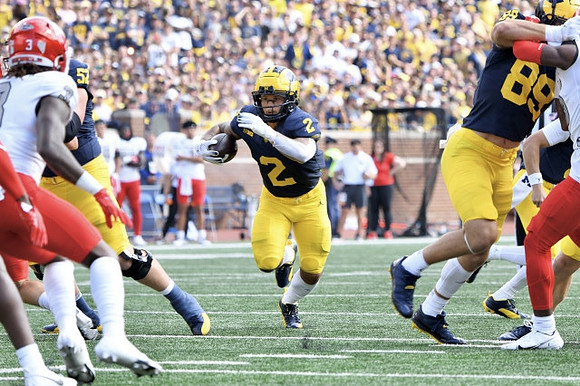 Karsen Barnhart (52), Blake Corum (2), and AJ Barner (89)