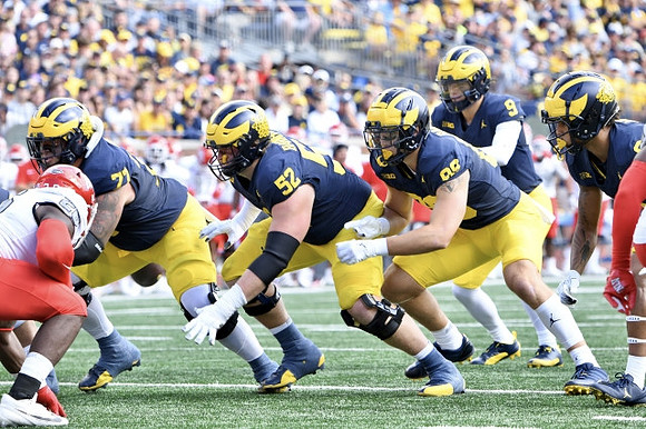 Trevor Keegan (77), Karsen Barnhart (52), AJ Barner (89), and J.J. McCarthy (9)