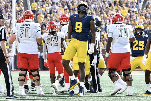 Derrick Moore (8), Kenneth Grant (78), and Junior Colson (25)