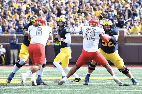 J.J. McCarthy (9) and Karsen Barnhart (52)