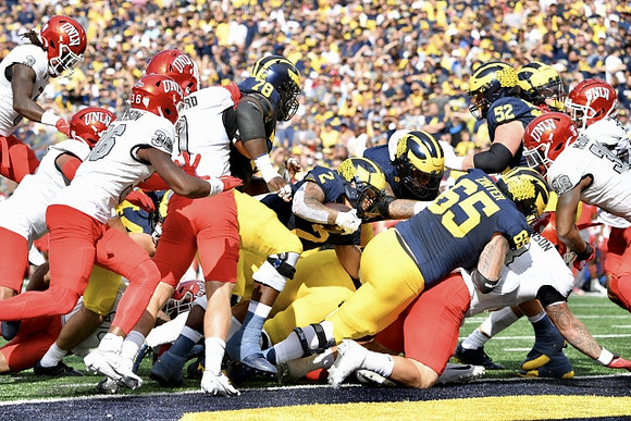 Myles Hinton (78), Blake Corum (2), Zak Zinter (65), and Karsen Barnhart (52)