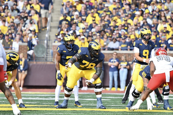 Donovan Edwards (7), Myles Hinton (78), and J.J. McCarthy (9)