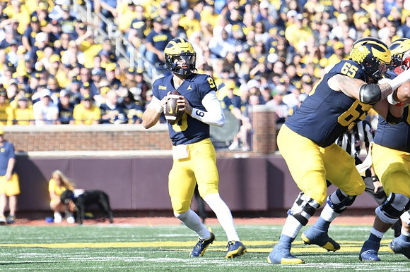 J.J. McCarthy (9) and Zak Zinter (65)