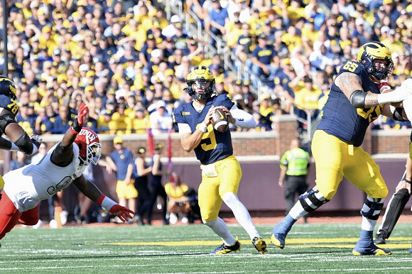 Myles Hinton (78), J.J. McCarthy (9), and Zak Zinter (65)