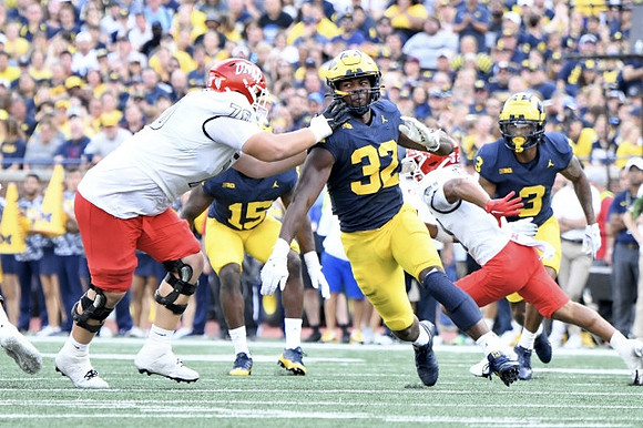 Ernest Hausmann (15), Jaylen Harrell (32), and Keon Sabb (3)
