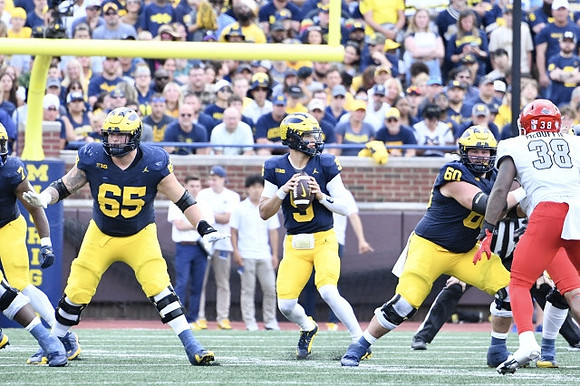 Donovan Edwards (7), Zak Zinter (65), J.J. McCarthy (9), and Drake Nugent (60)