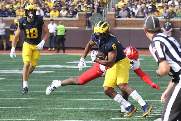 Colston Loveland (18) and Cornelius Johnson (6)