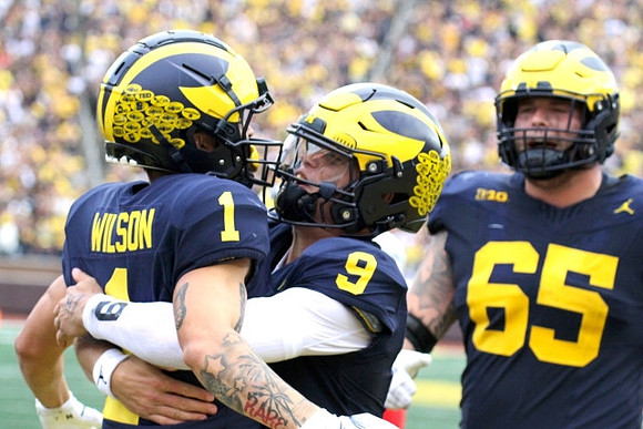 Roman Wilson (1), J.J. McCarthy (9), and Zak Zinter (65)