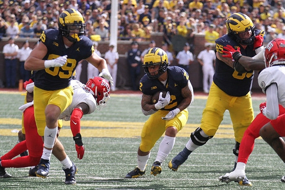 AJ Barner (89), Blake Corum (2), and Zak Zinter (65)