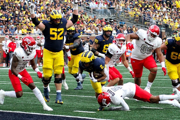 Karsen Barnhart (52), Myles Hinton (78), Blake Corum (2), Zak Zinter (65), and Drake Nugent (60)