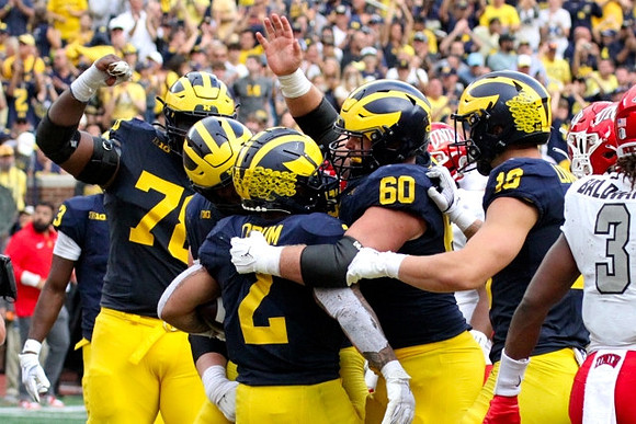 Myles Hinton (78), Blake Corum (2), Drake Nugent (60), and Colston Loveland (18)