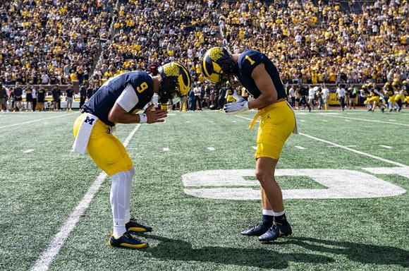 J.J. McCarthy (9) and Roman Wilson (1)