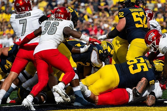 Myles Hinton (78), Blake Corum (2), Zak Zinter (65), and Karsen Barnhart (52)
